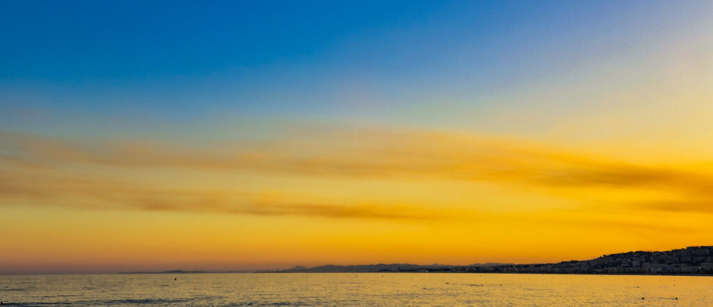 View of the Nice and the sea at sunset taken from the Promenade des Anglais.