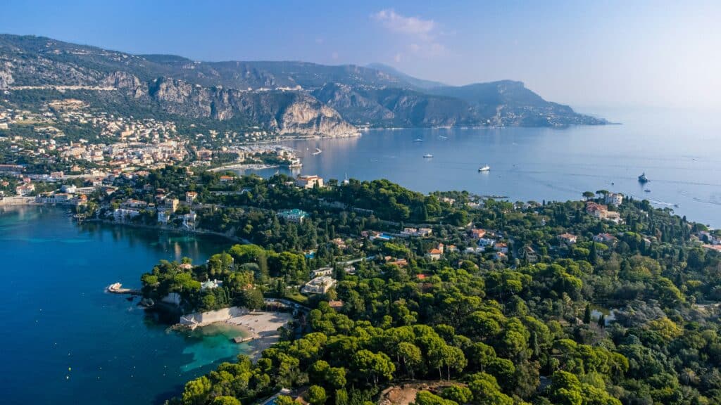 Rugged limestone cliffs along the Saint-Jean-Cap-Ferrat coastal walk path looking toward the Mediterranean